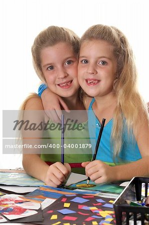 sisters coloring together vertical