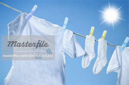 Clothes drying on clothesline on a summer day