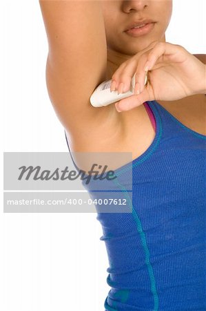 Woman applying deodorant in stick on to her armpits