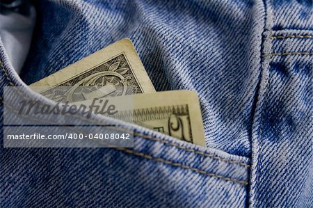 US currency in blue jeans pocket.