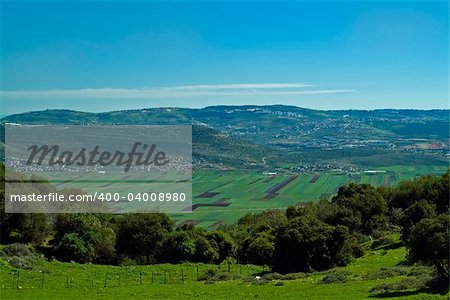 view of Beit Netofa valley in the Galilee, Israel, with Nazaret on the horizon