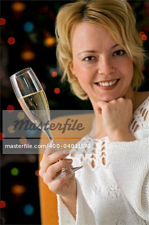 Woman with champagne toasting - shallow depth of field