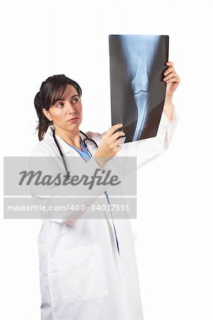 Friendly female doctor in lab coat , examining x-ray against white background