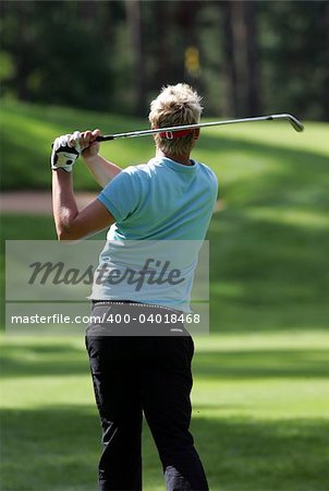 Golfer strikes a tee shot