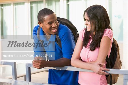 Male and female university students on campus