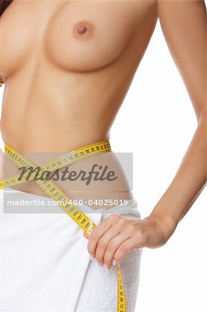 Woman measuring her waist