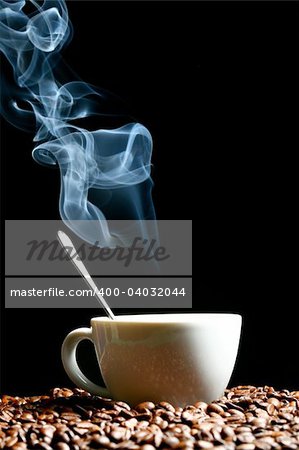 coffee beans and white hot cup of drink