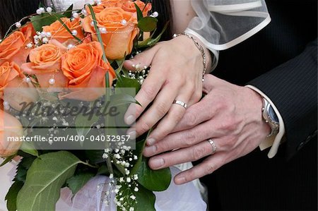 nice orange roses from the wedding and hands