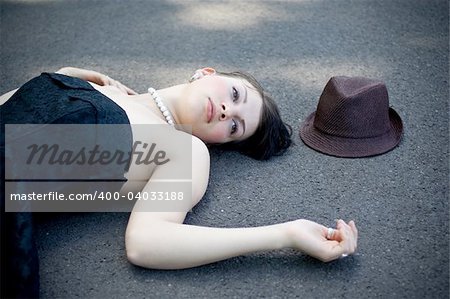 girl laying on the street