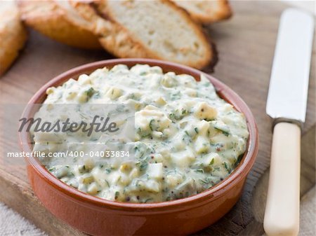 Dish of Sauce Gribiche with Toasted Baguette