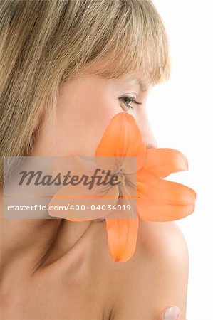 fresh and beautiful portrait of a woman with an orange lily