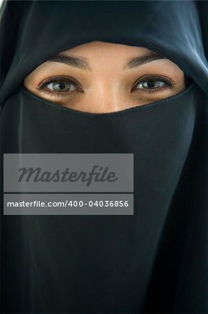 Portrait of a middle eastern woman wearing a black hijab