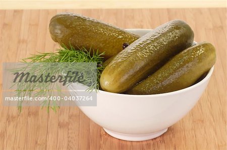 Pickled cucumbers with dill in a bowl