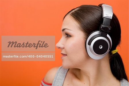 attractive brunette woman with headphones