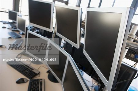 Empty office space with many monitors