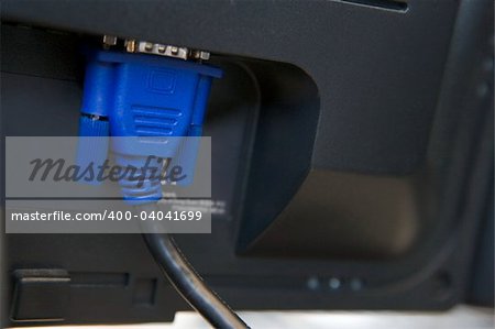 Shot of a cable plugged into a computer monitor