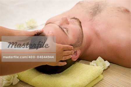 happy man relaxing in spa salon