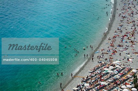 crowded city beaches of nice, on the cote d'azur, south of france