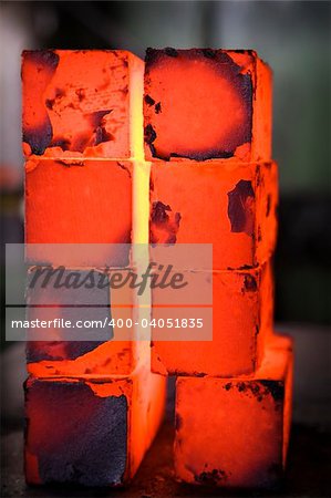 piles of hot iron blocks in foundry. Narrow focus