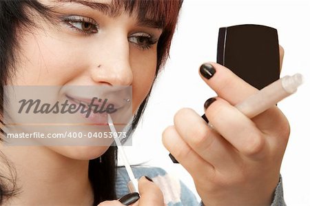 Woman applying make up