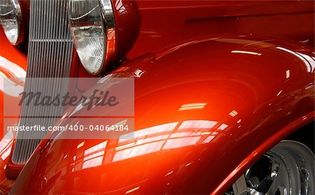 Close-up of a shiny orange hot rod