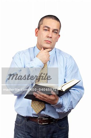 Serious business man thinking and holding one book over a white background