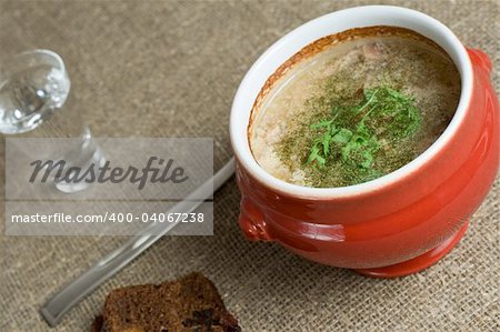 soup served in a ceramics pot, shallow DOF