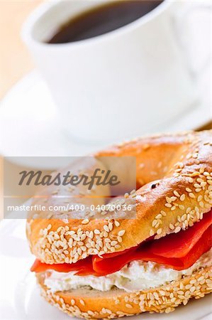 Light meal of smoked salmon bagel and coffee