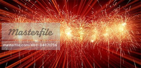 Digitally enhanced firework.  Red row of rockets with light rays in background. Banner (panorama) format.