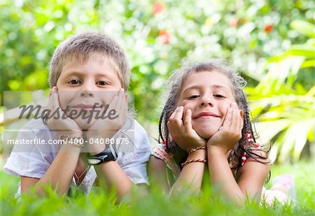 Portrait of little kids having good time in summer environment