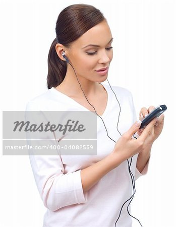 Beautiful young lady is listen to the music, isolated