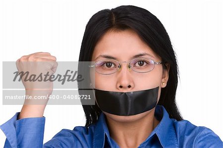 A young woman with her mouth plastered and her fist raised. Shoot against very bright white background to separate it with the model naturally.
