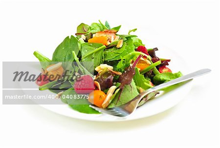 Plate of fresh green salad isolated on white background