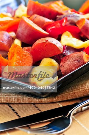 Vegetarian dish of roasted yams with cheese and peppers