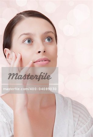 Portrait of young beautiful woman on pink background