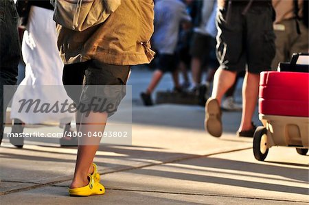 Crowd of people walking on a street