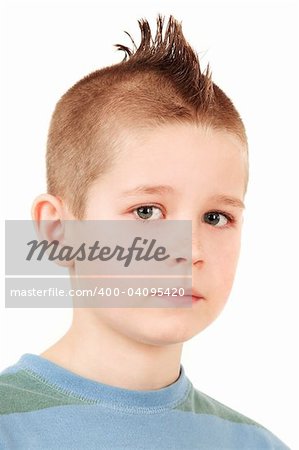 Young schoolboy in closeup portrait isolated on white background