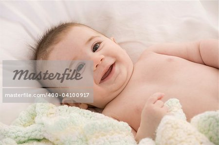 A very cute happy Caucasian baby boy
