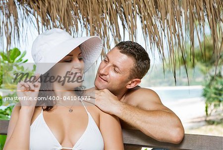 a portrait of attractive couple having fun in summer environment