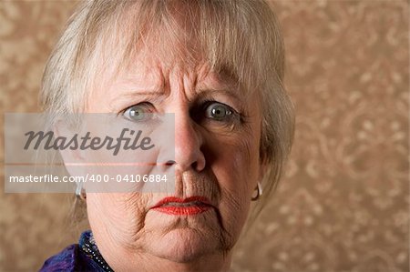 Closeup portrait of horrified senior woman with bright lipstick