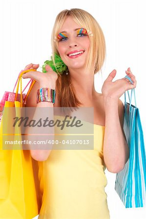 Portrait of a beautiful blonde woman with light blue eyes and colorful make-up holding shopping bags isolated on white background