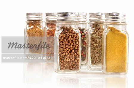 Assorted spice jars isolated on white background