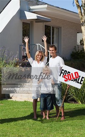 Family in front of House that they have just bought