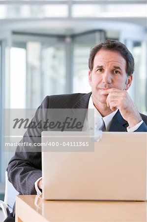 Senior business man working on laptop