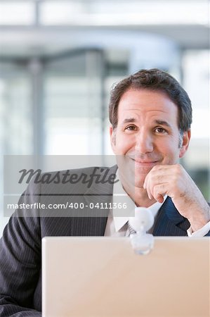 Senior business man working on laptop