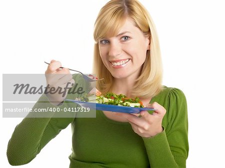 young woman holding in her hand a bowl of salad