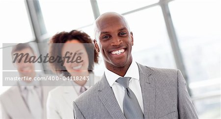 Smiling African businessman in a row