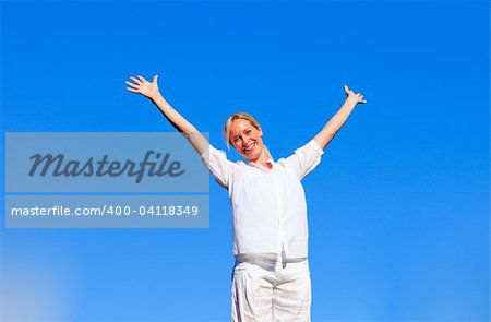 Happy woman doing exercises outdoors