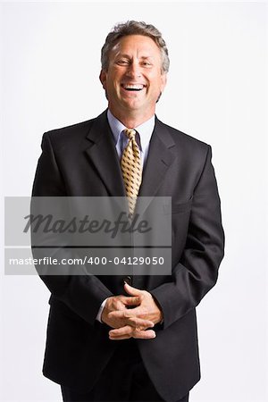 Businessman with hands clasped