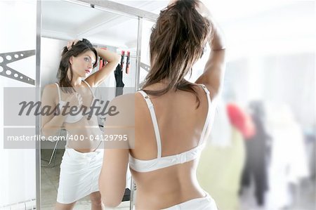Beautiful blue eyes woman on the mirror as a twins portrait